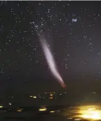  ??  ?? The phenomenon called STEVE, photograph­ed from an aircraft window, with the Zodiacal Light to the right of it