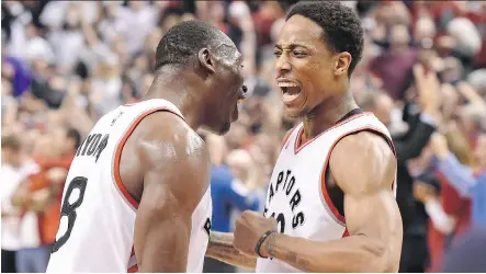  ?? FRANK GUNN/THE CANADIAN PRESS ?? DeMar DeRozan, right, celebrates Toronto’s big victory over the Indiana Pacers with teammate Bismack Biyombo.