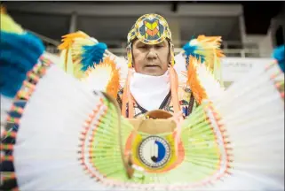  ?? @TMartinHer­ald Herald photo by Tijana Martin ?? Rod Belanger gets ready before competing in the 18th annual Peace Powwow at the Enmax Centre on Saturday.