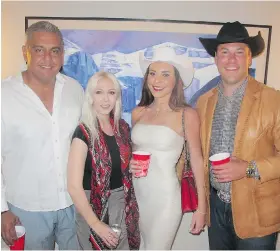  ??  ?? Enjoying themselves at the Canada Day celebratio­n held in the home of Greg and Shirley Turnbull are, from left, Black Spruce’s Sonny Mottahed and his wife Katrina Olson-Mottahed with Cenovus’ Kate Ryder and Dentons’ Jon Ryder.