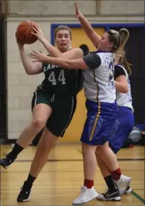  ?? PHOTOS BY PETER LEE, RECORD STAFF ?? Elmira’s Cobi Morris, left, drives for the basket against Grand River Collegiate Institute defender Mya Kochut in Tuesday’s 40-23 victory.