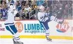  ?? JEANINE LEECH ICON SPORTSWIRE ?? Leafs defenceman Morgan Rielly, right, celebrates his second-period goal against the Penguins on Saturday.