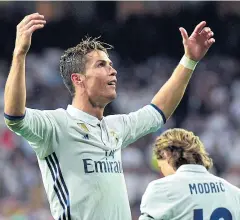  ?? AFP ?? Real Madrid’s Cristiano Ronaldo celebrates after scoring against Sevilla.