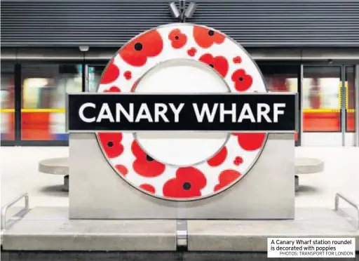  ?? PHOTOS: TRANSPORT FOR LONDON ?? A Canary Wharf station roundel is decorated with poppies