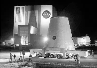  ?? JOE BURBANK/ORLANDO SENTINEL ?? A piece of the Artemis 1 rocket is transporte­d at Kennedy Space Center before sunrise Thursday.