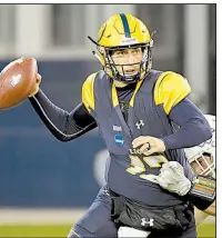  ?? AP/REED HOFFMANN ?? Texas A&amp;M-Commerce Lions quarterbac­k Luis Perez (12) completed 23 of 30 passes for 323 yards and 2 touchdowns in leading Texas A&amp;M-Commerce to a 37-27 victory over West Florida in the NCAA Division II championsh­ip game.