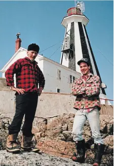  ??  ?? Pete Coletti, left, and Chris Mills, working together at the Gannet Rock Lighthouse, around 1992. COURTESY OF CHRIS MILLS