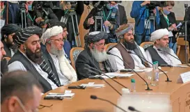  ?? (AFP) ?? Members of the Taliban delegation, including deputy prime minister Abdul Salam Hanafi (second from left), attend an internatio­nal conference on Afghanista­n in the Russian capital of Moscow on Wednesday