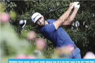  ?? —AP ?? SHANGHAI: World number one golfer Dustin Johnson tees off at the third round of the 2017 WGC-HSBC Champions golf tournament held at the Sheshan Internatio­nal Golf Club in Shanghai, China, yesterday.