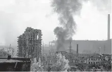  ?? Alexei Alexandrov / Associated Press ?? Smoke rises Wednesday from the Azovstal steelworks, which Russian troops are fighting to capture, in Mariupol.