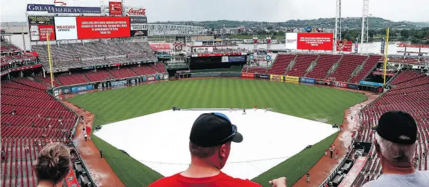  ?? JOHN MINCHILLO / THE ASSOCIATED PRESS ?? Heading into the weekend, MLB average attendance was 27,207, down six per cent from 28,931 on the Friday before Memorial Day last season.