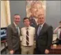  ?? SUBMITTED PHOTO ?? U.S. Rep. Brian Fitzpatric­k, R-1, left, Pennridge High School student Justin Lyons and U. S. House Minority Leader Kevin McCarthy stand near a portrait of former President Ronald Reagan in McCarthy’s office.