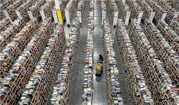  ?? RALPH D. FRESO/REUTERS ?? Enormous warehouses like Amazon’s are coming closer to home as the online retailer opens in Australia.