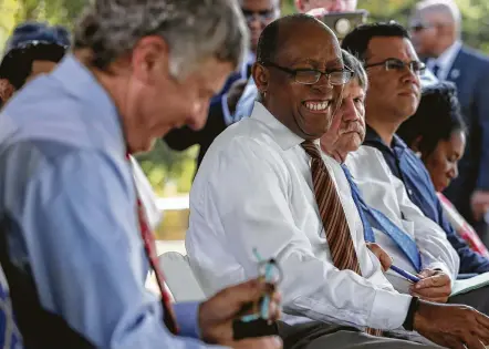  ?? Photos by Yi-Chin Lee / Staff photograph­er ?? Houston Mayor Sylvester Turner and Harris County Judge Ed Emmett share a laugh before a press conference on the banks of White Oak Bayou on Thursday to rally for Propositio­n A in the upcoming Harris County Flood Control District bond vote.