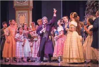  ?? MARK FROHNA ?? Timothy O’Donnell (center) plays multiple roles in the Milwaukee Ballet’s production of “The Nutcracker.”