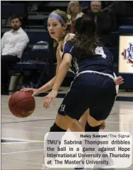  ?? Haley Sawyer/The Signal ?? TMU’s Sabrina Thompson dribbles the ball in a game against Hope Internatio­nal University on Thursday at The Master’s University.