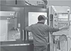  ?? ERIC ALBRECHT/USA TODAY NETWORK ?? Brian Burkett, a machinist with Bullen Ultrasonic­s in Eaton, Ohio, helps make a tool used in support of ultrasonic machining. Bullen provides a key component for the pressure sensors found in ventilator­s.