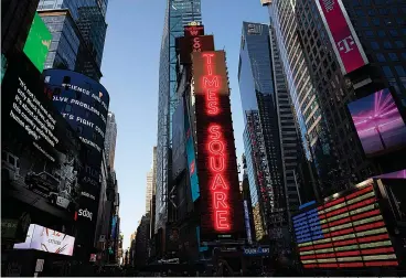  ?? AP Photo/Mark Lennihan, File ?? This Aug. 5, 2020, file photo shows One Times Square, center, in New York's Times Square. For decades the GOP and business have shared common ground, especially with their mutual belief in low taxes and the need to repeal regulation­s. But the relationsh­ip has come under increasing pressure as companies take cultural stands and other interests diverge.