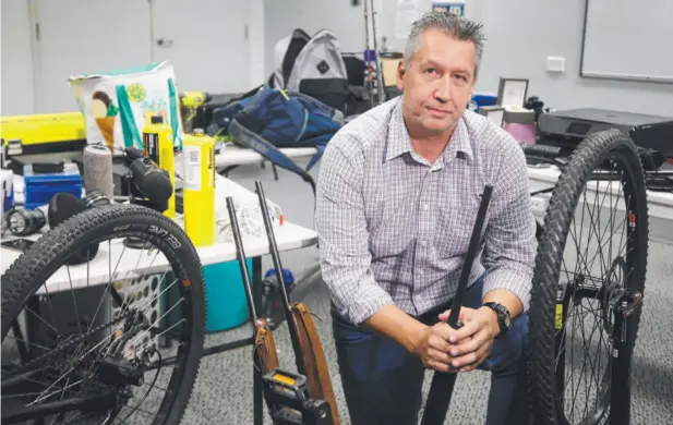  ?? Picture: TONI CALDWELL ?? BIG HAUL: Det A/Sgt Anthony Ellis from the Cairns Property Crime Squad said police will spend the next few days sifting through hundreds of stolen items that have been seized in raids this week. He said the items could potentiall­y belong to dozens of...