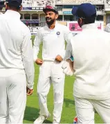  ?? AP ?? Indian captain Virat Kohli shares a laugh after winning the third Test against England.