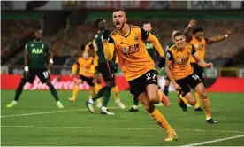  ??  ?? Wolves defender Romain Saïss celebrates after scoring the equaliser with a header from Pedro Neto’s corner. Photograph: Ryan Browne/BPI/Shuttersto­ck