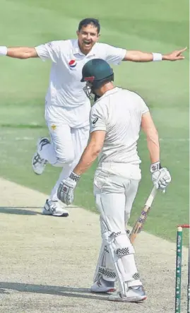  ?? AP ?? ■ Pakistan’s Mohammad Abbas celebrates the wicket of Shaun Marsh during the second day of the second Test in Abu Dhabi on Wednesday.