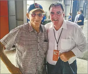  ??  ?? Robert Hughes with Newcastle Jets coach Laurie Mckinna.