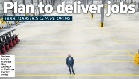  ??  ?? Dachser branch manager Gary Atkinson at the huge logistics centre