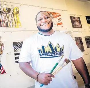  ?? SCOTT LUXOR/CONTRIBUTE­D PHOTOS ?? Will Simpson, a local artist, stands in front of some of his artwork.