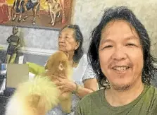  ??  ?? Nick Pichay in a lockdown groufie with his Tia Caring and dog Random