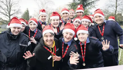  ??  ?? Cheltenham Sea Cadets from TS Legion who helped at the finish line at the Cheltenham Santa Run in Pittville Park on Sunday morning