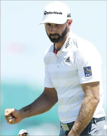  ?? — GETTY IMAGES ?? Dustin Johnson celebrates his shot on the first green during the first round of the U.S. Open at Shinnecock Hills Golf Club in Southampto­n, N.Y. Thursday. Inset, Tiger Woods is well off the lead after an 8-over score.