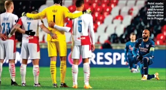  ??  ?? Point made: Lacazette and Arsenal take the knee ahead of the tie in Prague