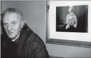  ??  ?? Beside himself: The late Con Houlihan Con’s Bar in the River Island Hotel with a study of himself during the filming of the documentar­y on his life in September 2002. Photo: John Reidy