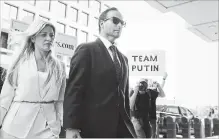  ?? JACQUELYN MARTIN THE ASSOCIATED PRESS ?? Former Donald Trump presidenti­al campaign foreign policy adviser George Papadopoul­os and his wife Simona Mangiante arrive at federal court for his sentencing on Friday in Washington.