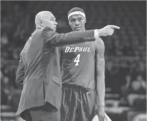  ?? JEFFREY BECKER/ USA TODAY SPORTS ?? Coach Dave Leitao, talking with forward Paul Reed, has guided DePaul to 8- 0, the best start in school history in three decades.