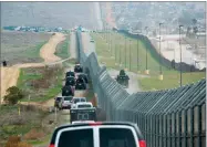  ?? AP PHOTO BY EVAN VUCCI ?? In this March 13 file photo, a motorcade carrying President Donald Trump drives along the border in San Diego.