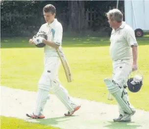  ?? Stewart Conway ?? Runcorn’s Dan Booth (left) leaves the wicket after his record-breaking innings of 180 not out against Macclesfie­ld on Sunday.