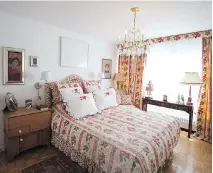  ??  ?? Drapes and matching bedspread are seen in the master bedroom.