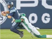 ?? JON BLACKER THE CANADIAN PRESS ?? Argo QB McLeod Bethel-Thompson completed 32 of 44 passes despite pressure from Willie Jefferson and the Riders D.