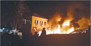  ?? (MDA) ?? A FIRE RAGES from the site of an explosion that caused a building to collapse in Jaffa on Monday.