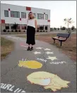  ?? ?? Swift Current artist Chelsea Angell stands at a sensory pathway located at the École Centennial and All Saints Catholic schools.