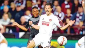  ?? AFP ?? Raheem Sterling (L) vies with Hearts Australian defender Ryan McGowan during the UEFA Europa League Qualifying Play-Off.