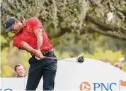  ?? Kevin Kolczynski/Associated Press ?? Tiger Woods tees off on the 13th hole during the final round of the PNC Championsh­ip golf tournament on Dec. 17 in Orlando, Fla.