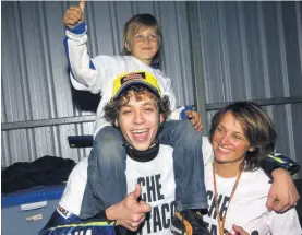  ??  ?? Celebratin­g victory at Phillip Island in 2004 where he had beaten Gibernau and Capirossi to the flag. Here he is with mum Stefania and half brother Luca Marini – now a VR46 Academy rider and tipped to join Rossi’s new team