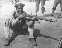  ?? CHICAGO TRIBUNE ARCHIVE ?? Pvt. Fritz Pollard Jr. served in the military just like his father. Pollard Jr. served as a rifle range instructor for other Black soldiers in the Engineer Replacemen­t Training Center at Fort Leonard Wood in Missouri, circa 1942.