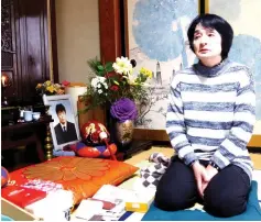  ??  ?? Taeko Watanabe, whose son Yuki committed suicide in 2008, talks in front of his portrait at her home in Akita. — Reuters photo