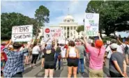  ?? AP PHOTO/ BUTCH DILL ?? Protesters for women’s rights hold a rally Sunday on the Alabama Capitol steps in Montgomery, Ala., to protest a law passed last week making abortion a felony.