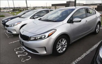  ?? DAVID ZALUBOWSKI - THE ASSOCIATED PRESS FILE PHOTO ?? In this 2018 file photo, a used 2017 Kia Forte sits in a row of other used, late-model sedans at a dealership in Centennial, Colo. Consumers bought an estimated 40.4 million used vehicles last year, likely passing the old record of 40.2 million set in 2018, according to figures from the Edmunds.com auto pricing site.