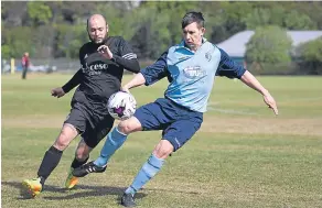  ??  ?? This Riverside CSC player (light blue) holds off a Cannon Fodder opponent. River ended the fixture as 4-0 victors.